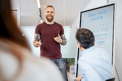 Man explains ‘Search Engine Domination’ on a whiteboard