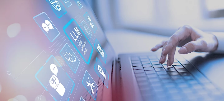 Humans use AI systems on laptops
