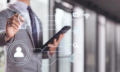 Businessman uses AI optimization on hologram screen