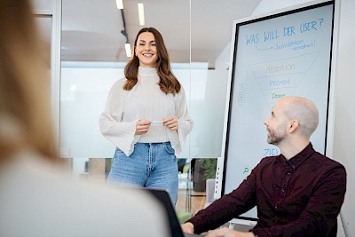 Woman presenting Funnel on a whiteboard