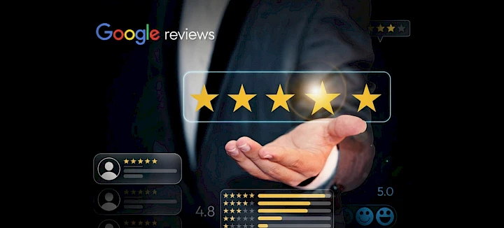 The hand displays ratings; in the top left-hand corner are Google reviews and various scores